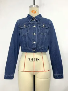 Front view of a stylish blue cropped denim jacket displayed on a white mannequin