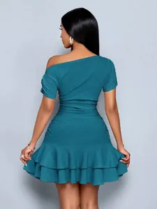 Back view of an elegant teal one-shoulder bodycon dress with ruffled hem texture