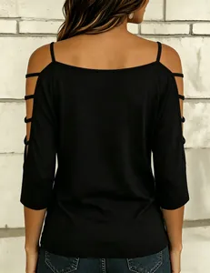 Back view of a black cold shoulder T-shirt with unique horizontal strap details on sleeves.