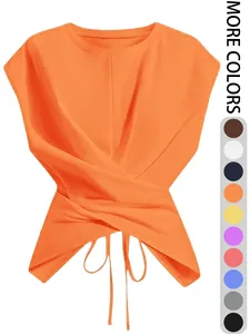 Vista detallada del top corto naranja con cordones cruzados y múltiples opciones de color.