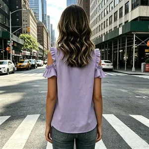 Back view of a trendy lavender purple cold shoulder top featuring ruffle sleeve details
