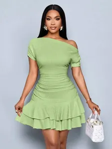 Elegant sage green one-shoulder slim fit dress with ruffled hem and textured fabric