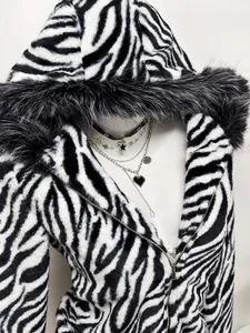 Detailed macro view of the zebra print faux fur texture and hood on a stylish ladies jacket