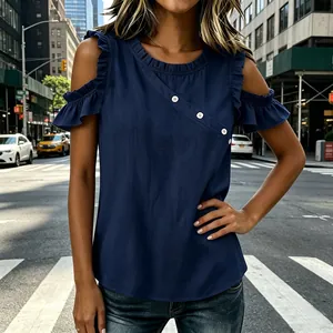 Detail of stylish navy blue cold-shoulder top with ruffled sleeves and white buttons