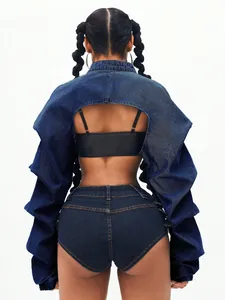 Back view of a trendy cropped denim jacket with voluminous puff sleeves and cut-out design