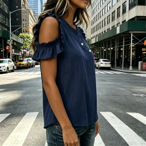 Close-up of navy blue cold shoulder top with ruffle sleeve detail and buttons