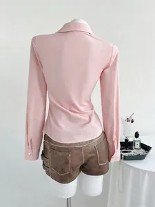 Detailed back view of an elegant pink long sleeve V-neck shirt with a slim fit design