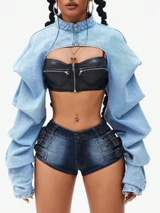 Detailed view of edgy women's blue denim shrug and black leather corset top for street style