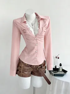 Elegant slim-fit pink V-neck blouse with delicate lace trim and front buttons detail.