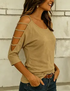 Detailed view of women's fashion khaki off-shoulder t-shirt with stylish cutout sleeve design