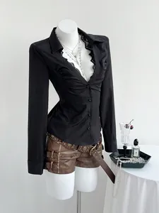 Detailed view of black slim-fit V-neck shirt with elegant lace trim and button-down front