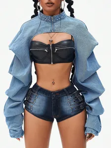 Close-up detail of a stylish street fashion cropped denim jacket and mini shorts set.