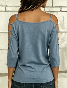 Back view of casual blue cold shoulder 3/4 sleeve top with strappy cutout details