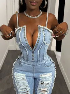 Close-up view of a sexy light blue denim jumpsuit featuring a deep V-neck and stud details