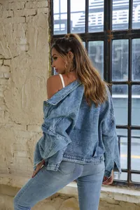 Back view of a casual retro loose denim jacket for women in industrial setting