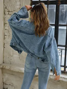 Rear view of a vintage loose denim jacket for women featuring washed fabric details