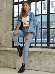 Stylish retro loose denim jacket with oversized pockets paired with white crop top