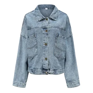 Front view of a light blue oversized denim jacket featuring two large utility pockets.