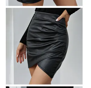Detail view of a black high-waisted irregular ruched PU leather mini skirt on a model
