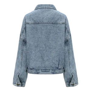 Back view of a women's vintage loose-fit denim jacket in light blue washed finish