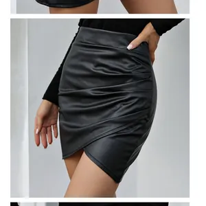 Elegant black PU leather mini skirt featuring irregular ruched design and high waist fit
