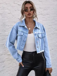 Close-up detail of light blue cropped denim jacket featuring raw hem and stylish loose fit