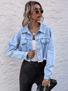 Stylish women's cropped light blue denim jacket featuring a frayed hem and front pockets