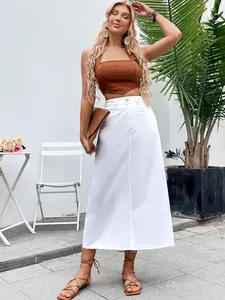 Full length view of a white high waisted A-line denim midi skirt with frayed hem