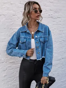 Full view of a stylish loose cropped blue denim jacket with trendy raw hem detailing.