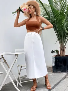 Full-length view of white high-waisted denim A-line skirt on model