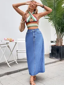 Full-length view of a high-waist A-line denim maxi skirt in a casual outdoor setting