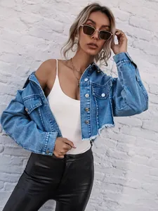 Stylish women's cropped denim jacket with distressed frayed hem and metallic buttons