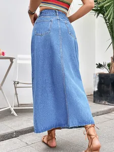 Back view of a trendy high-waisted light blue A-line denim midi skirt with pockets