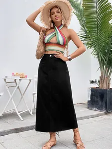Full length view of a stylish black high waisted A-line denim maxi skirt on a model