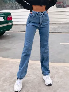 Detailed view of high-waisted blue straight denim jeans with knee seam stitching