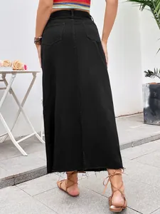 Rear view of a black high-waisted A-line denim maxi skirt with frayed hem detail