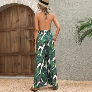 Sexueller rückenfreier Neckholder-Jumpsuit mit tropischem Blattprint für den Urlaub