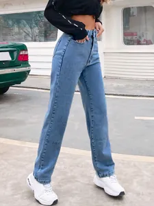 Outdoor street style shot of high-waisted light blue straight-leg denim jeans