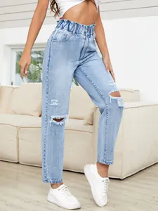 Stylish high-waisted light blue ripped straight-leg denim jeans for women in casual setting.