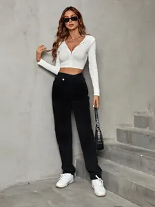 Full body view of high waisted loose black denim jeans for a casual street look