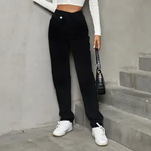 Fashionable high-waisted loose black denim pants for women shown on a model on concrete stairs