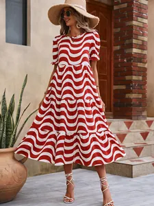 Detailed view of women's red and white wavy print tiered midi dress with bubble sleeves