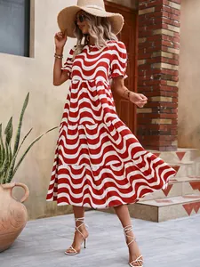 Bohemian style red and white wave print midi dress featuring puff sleeves and tiered skirt