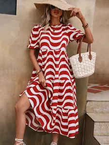Detail of red and white wave print puff sleeve dress for summer vacation attire.