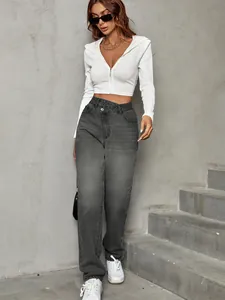 Trendy high-waisted grey denim jeans featuring unique asymmetric button waist design