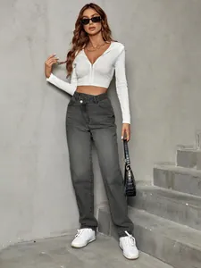 Stylish high-waisted loose denim pants for women with a crossover waist design.