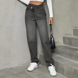 Detailed view of high waisted wide leg jeans with unique asymmetric crossover waist