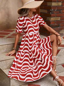 Detailed view of red and white wave print dress with stylish puff sleeves