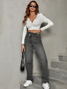 Model wearing dark grey high-waisted loose denim jeans with a unique asymmetric waistline