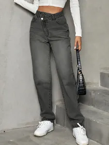 Detailed view of grey high waist loose jeans featuring unique asymmetrical waist design.